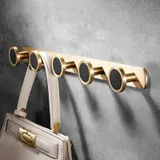 Barre porte manteau dorée, vue 1